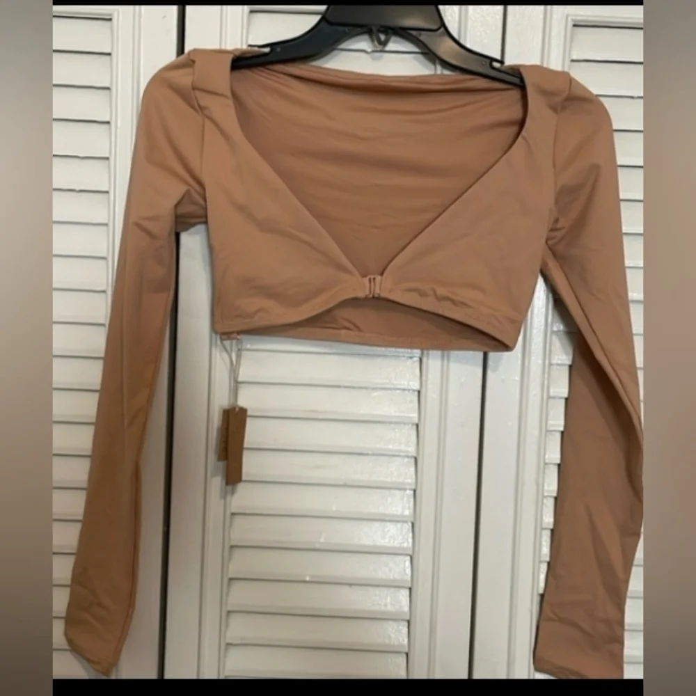 Skims long sleeve shrug.